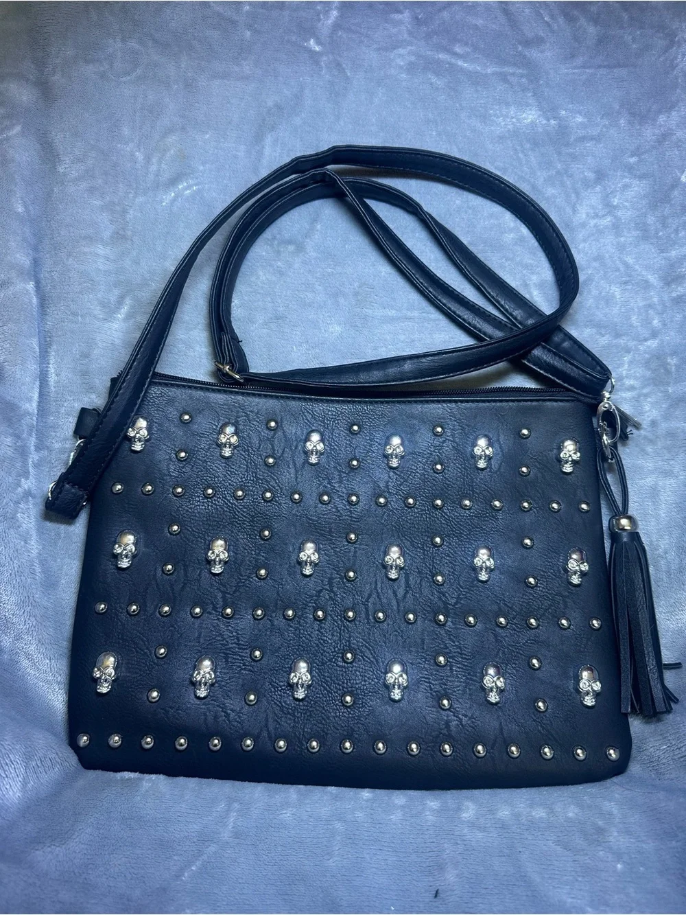 Black Studded Crossbody Bag with Skull Accents and Tassel Detail